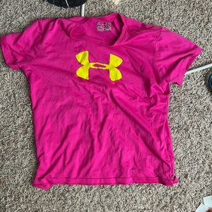 Under armor athletic shirt, pink, with green under armor sign in front